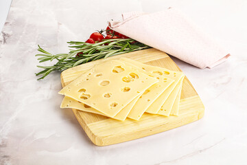 Sliced maasdam cheese with holes