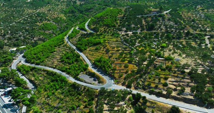 AERIAL: Traffic on a curvy mountain road in Makarska riviera, summer in Croatia