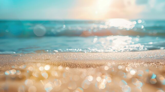 Natural blurred defocused background for concept summer vacation. Nature of tropical summer beach with rays of sunlight. Light sand beach, ocean water sparkles against blue sky advertising style image