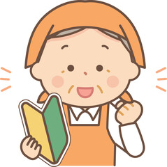 初心者マークを持ってガッツポーズをするエプロンのシニア女性