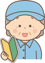 初心者マークを持っている作業服のシニア女性