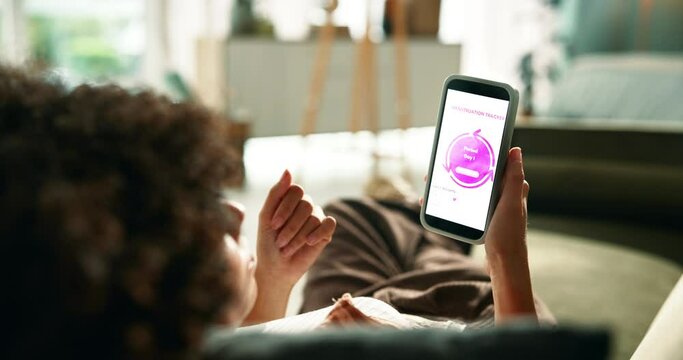 Woman, hands and checking menstrual cycle with phone screen for update, time or hormonal phase at home. Back of young female person counting period days on mobile smartphone display for ovulation app