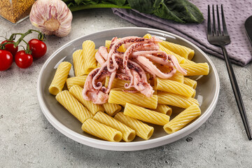 Italian cuisine - pasta tortiglioni with squid