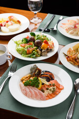 Korean buffet meal salad sushi dumpling fruit vegetable meat