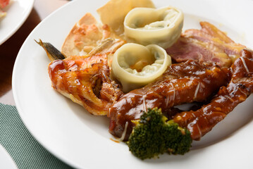 Korean buffet meal salad sushi dumpling fruit vegetable meat