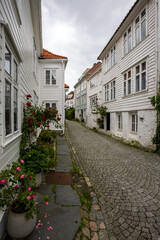 Charming old town alley with cobblestone path in Bergen, Norway