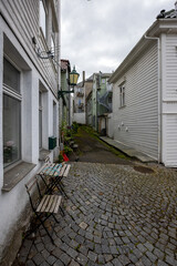 Picturesque cobblestone alley in quaint old town in Bergen, Norway