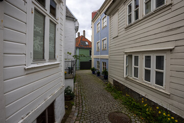 Charming old town alley with cobblestone path in Bergen, Norway