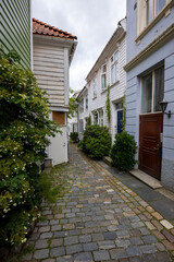 Charming old town alley with cobblestone path in Bergen, Norway