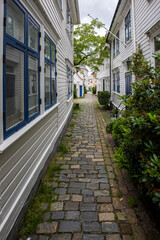 Charming old town alley with cobblestone path in Bergen, Norway