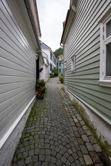 Charming old town alley with cobblestone path in Bergen, Norway
