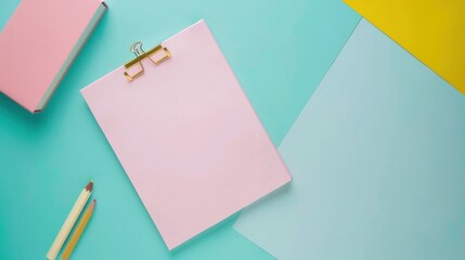Pastel clipboard on light blue and yellow surface.