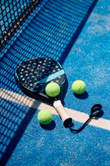 Paddle tennis equipment on  court.