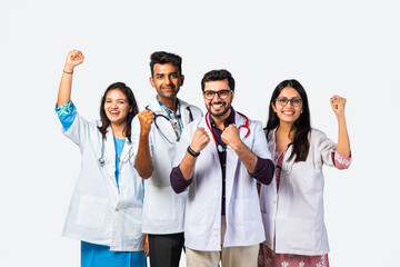 Indian asian group of medical doctors thumbs up, clappiing or celebrating success