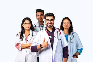 Fototapeta premium Indian asian group of medical doctors thumbs up, clappiing or celebrating success