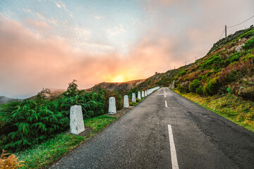 Fototapeta premium Sunrise over the mountains road landscape in Pico do Arieiro, Madeira Island, Portugal