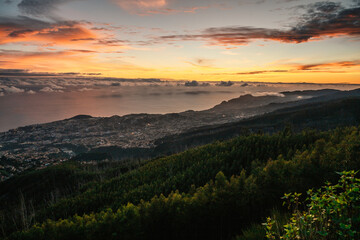 beautiful sunset over the city of Funchal on Madeira from the location Miradouro do Pico Alto....