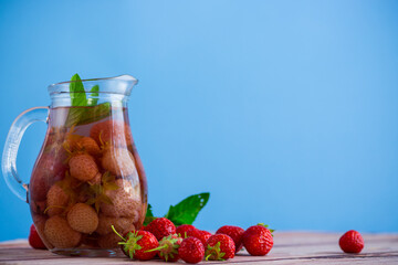 Sweet refreshing berry compote of ripe strawberries in a decanter