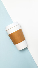 Mockup Paper Drinks Mug, Cup with White Lid and Corrugated Sleeve On White and Blue Background. Eco Hot Beverage Tumbler, Vertical Plane, Copy Space. On the Go Food Service Application