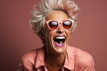 Elderly woman pensioner laughing joyfully with genuine happiness and contentment