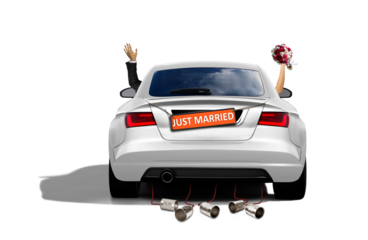 newlywed couple in a sport car driving away