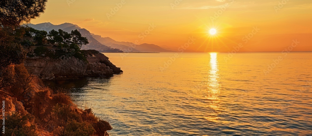 Poster beautiful golden sunset over the sparkling mediterranean sea with a breathtaking view in a copy spac