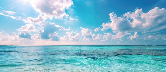 Obraz premium A horizontal shot showcasing a serene tropical sea, ideal for relaxation or meditation, with copy space image available.
