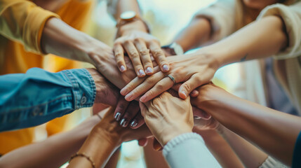 Group of people putting their hands together