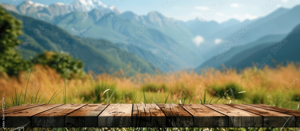 Aufkleber A wooden table top set against a blurry mountain and grass field backdrop, evoking a sense of freshness and relaxation. Ideal for displaying products or key visual designs with a view of copy space