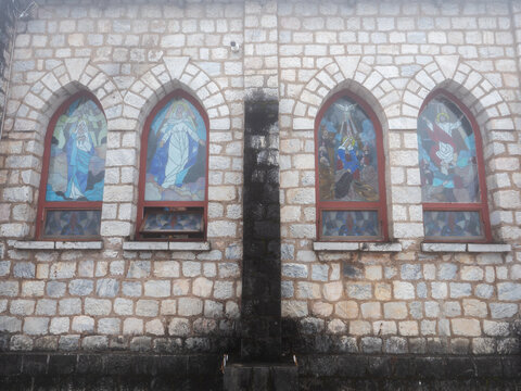 Stained Glass on The Church Window Depicts Jeus andThe Virgin Mary