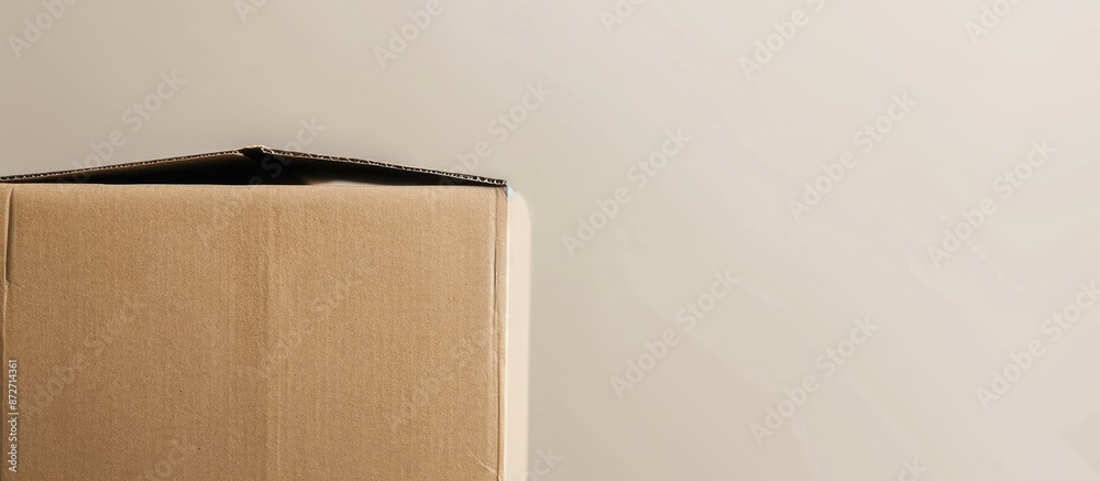 Poster An empty cardboard box is stacked alone against a white backdrop, leaving room for a copy space image.