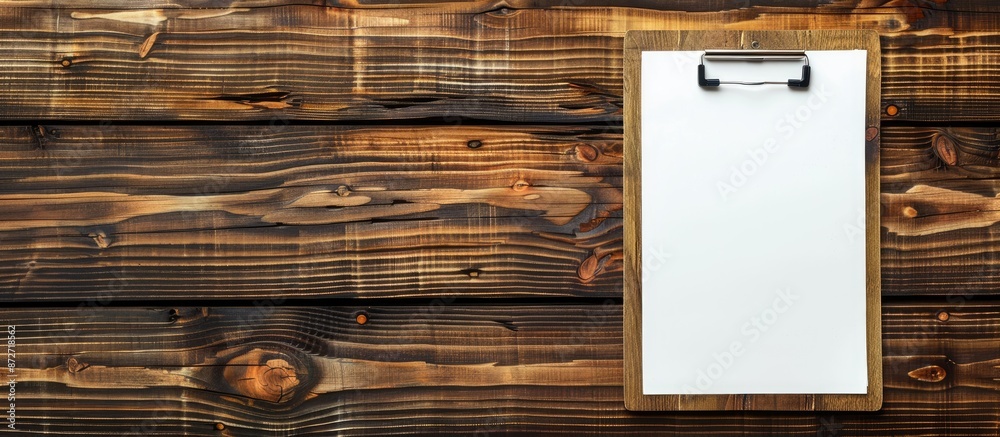 Poster wooden background with a blank clipboard for copy space image.