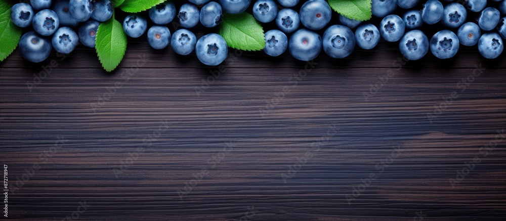 Poster top view of fresh and delicious blueberries creating a copy space image.