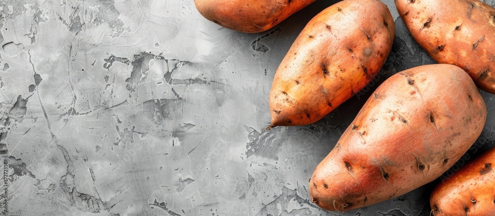 Poster Sweet potatoes displayed on a blank background with copy space image.