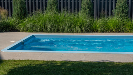 In the home pool, the counter-current system is turned on, making it an excellent place to swim in the backyard