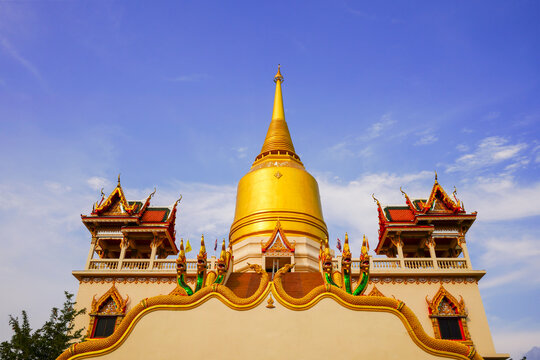 The Vipassana meditation building with a yellow bell-shaped pagoda at Wat Pai Luang is considered a beautiful building with a Naga staircase leading up to it, which can be seen from afar and looks bea