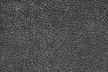 Velours black fabric with with embossed pattern like leather structure texture close up, macro