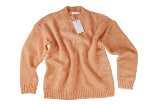 Orange flying crumpled women autumn knitted sweater with blank label tag isolated on white, transparent background. Creative clothing concept, cozy creasy jersey pullover. Fashion template, mockup