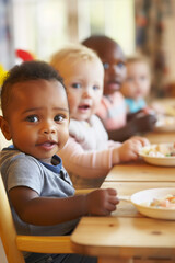 Toddlers Enjoying Meal Together at Table