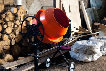 Firewood and concrete mixer in the barn