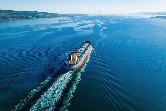 Bulk vessel for dry cargo cruising in sea, ship for unpackaged bulk cargo, aerial footage