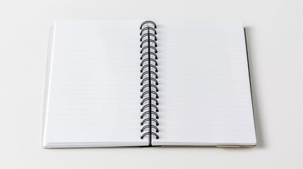 Paper spiral notebook against a white backdrop