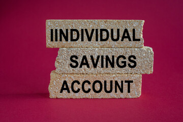 Financial freedom symbol. Concept words individual savings account on brick blocks. Beautiful red background. Savings, passive income. Business concept.