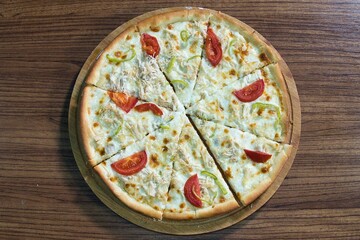 White Pizza With Tomatoes and Green Peppers