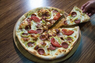 Pepperoni Pizza With Green Peppers and Tomatoes