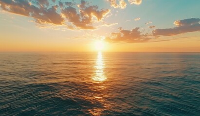 Obraz premium Beautiful sunset over the ocean with a blue sky, scenic view, calm seawater, drone aerial shot