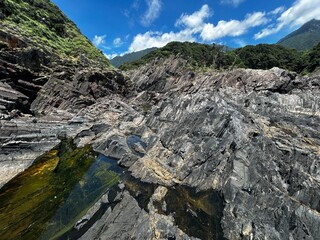 Near the Father Sidotti Landing Monument in Yakushima JAPAN, there is a beach where you can enjoy the magnificent terrain, geological formations and huge rocks.