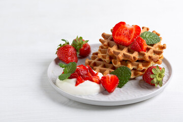 Delicious Belgian waffles with strawberries.