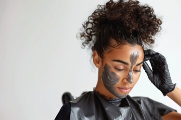 Fototapeta premium Hair stylist applying a hair treatment mask, wearing protective gloves and apron, looking concentrated, Portrait half-body, hyper-realistic, high detail, photorealistic, white background, studio