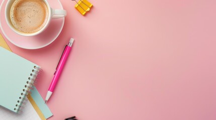 Coffee cup and pastel stationery on pink banner Top view with space for text